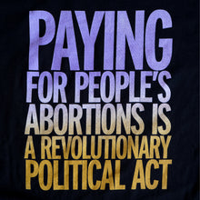 Load image into Gallery viewer, Black jersey fabric imprinted with text that reads &quot;Paying for people&#39;s abortions is a revolutionary political act&quot; in a purple to gold gradient.
